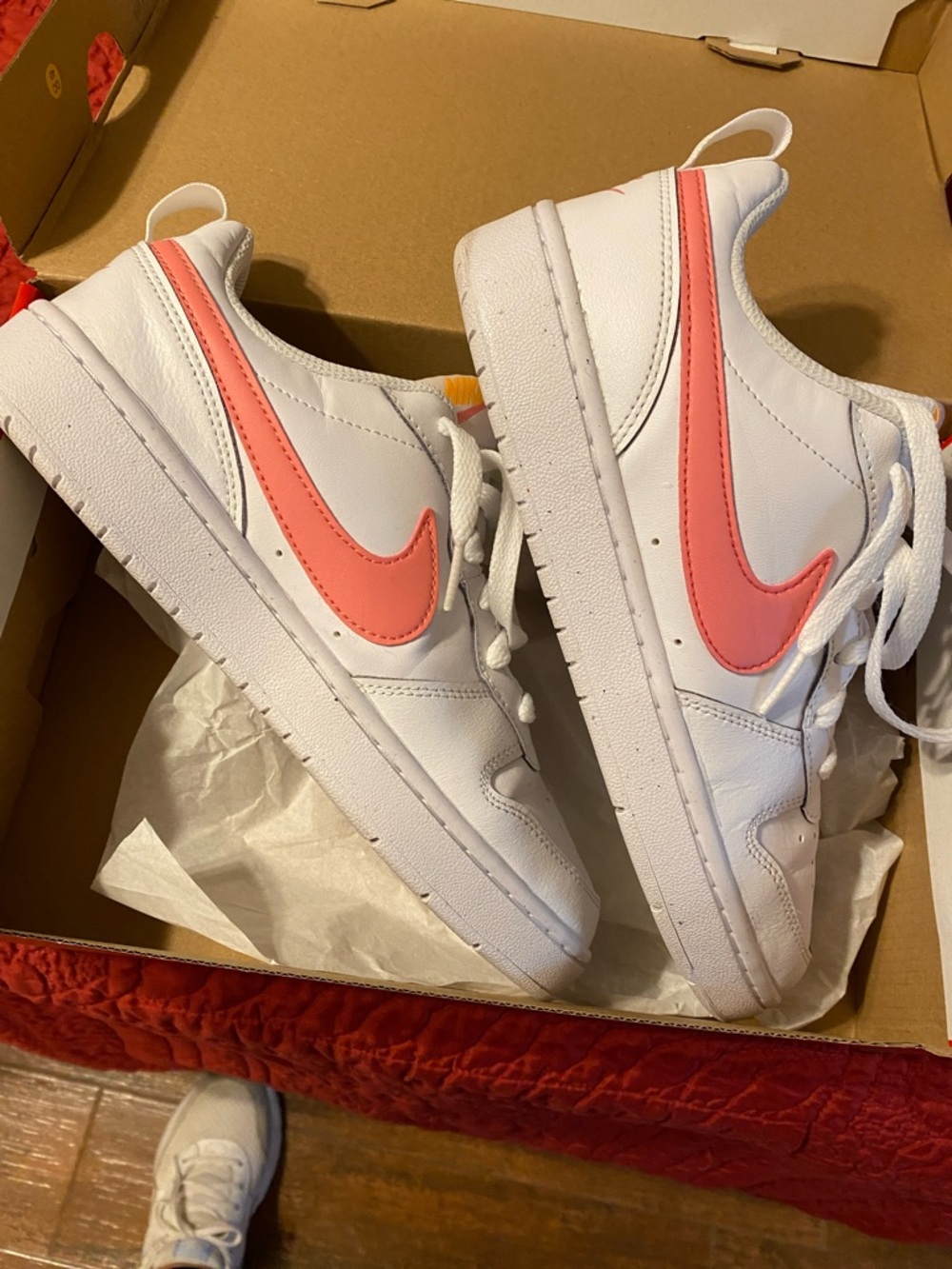 Nike White Low-Top Sneakers with Coral Pink Swoosh
